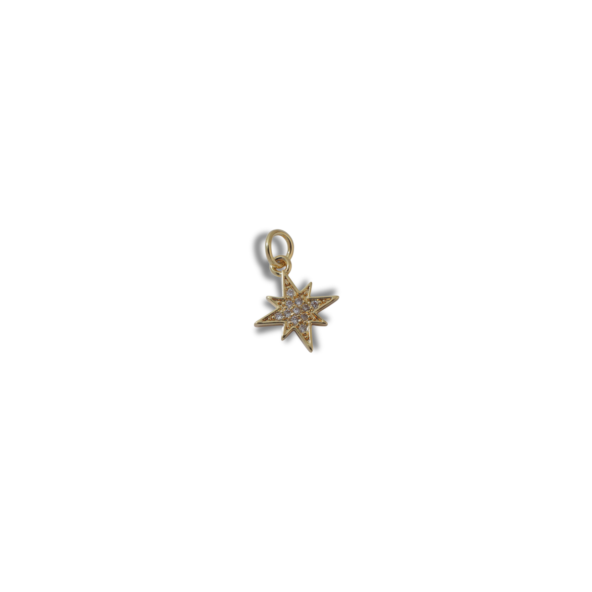 The Golden Spark Charm charm by Nashira, shown close up