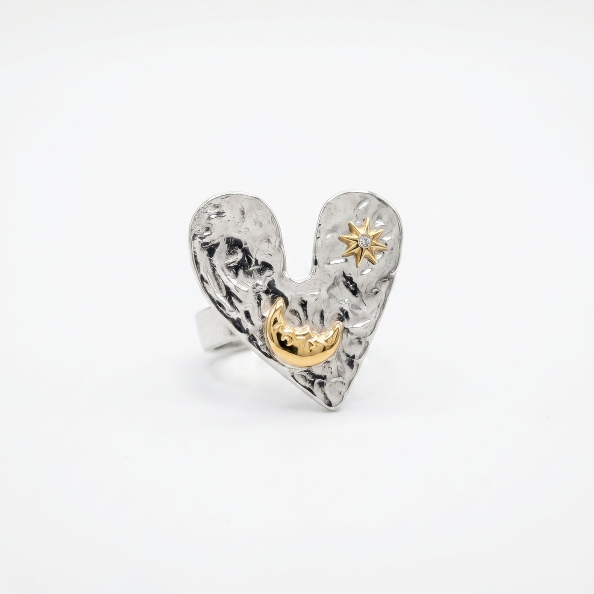 The Sun Moon & Heart Ring ring by Nashira, shown close up