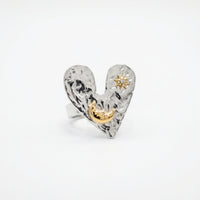 The Sun Moon & Heart Ring ring by Nashira, shown close up