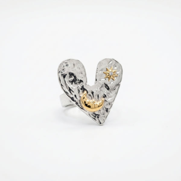 The Sun Moon & Heart Ring ring by Nashira, shown close up