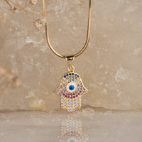 Nazar Studded Hamsa Pendant with Necklace necklace by Nashira, shown close up