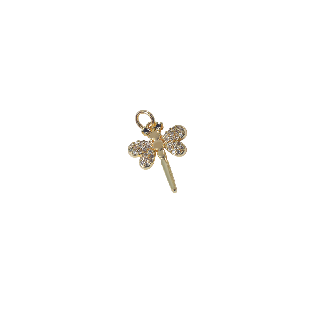 The Tiny Dragonfly Charm charm by Nashira, shown close up