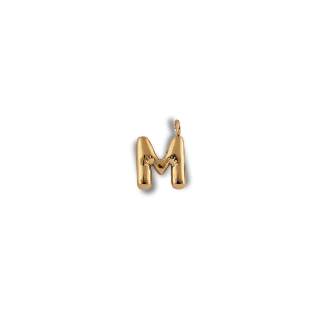 Alphabet Charm - M pendant by Nashira, shown close up