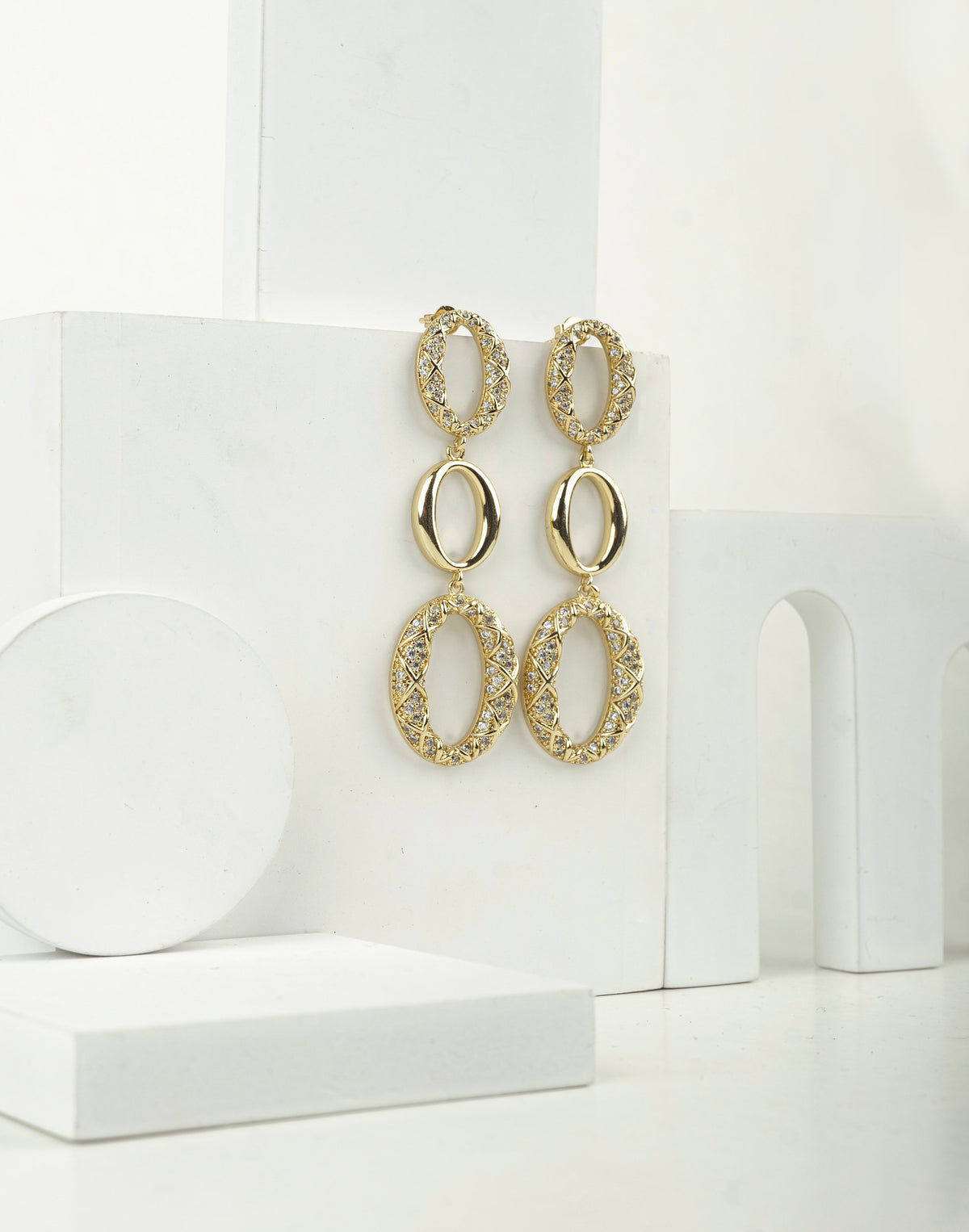 Triple Oh Danglers earrings by Nashira, shown close up
