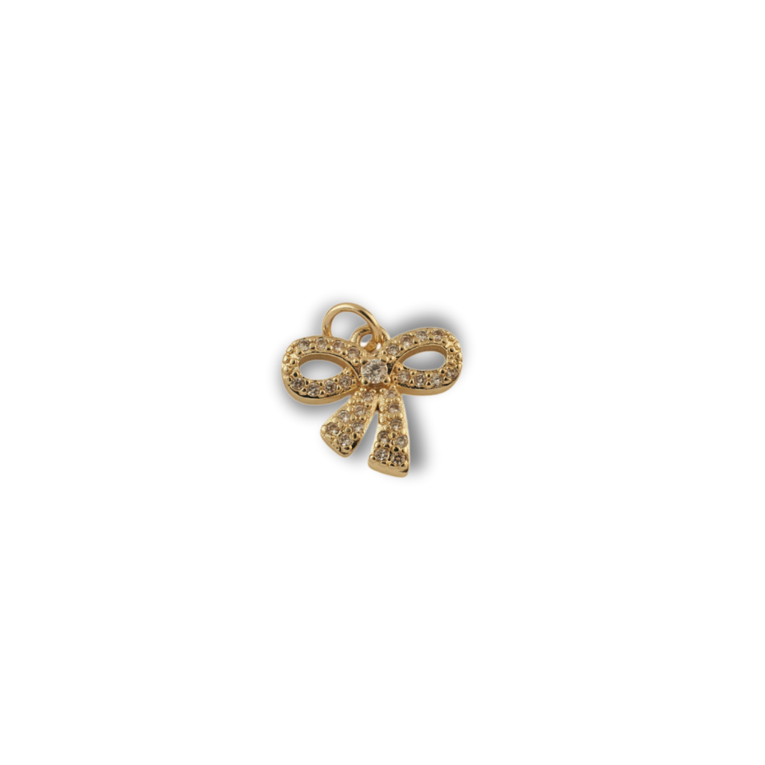 The Elegant Bow Charm charm by Nashira, shown close up