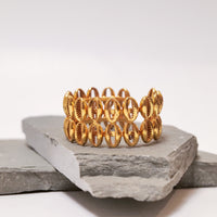 Gold Shell Bracelet bracelet by Nashira, shown close up