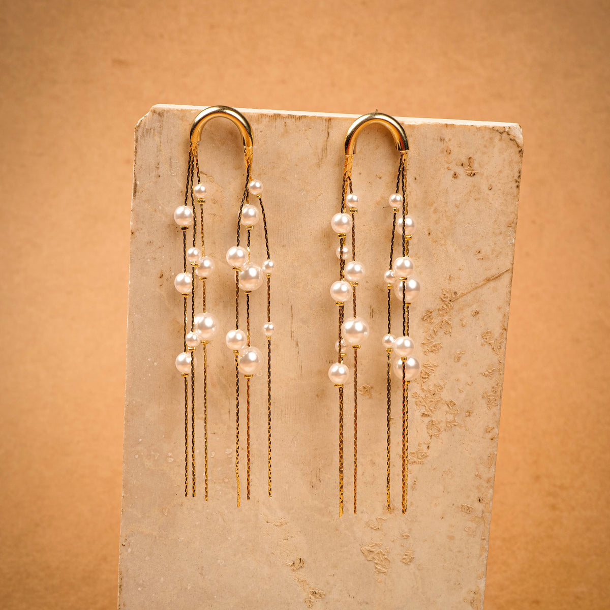 Pearl Chimes Earrings earrings by Nashira, shown close up