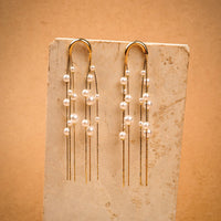 Pearl Chimes Earrings earrings by Nashira, shown close up