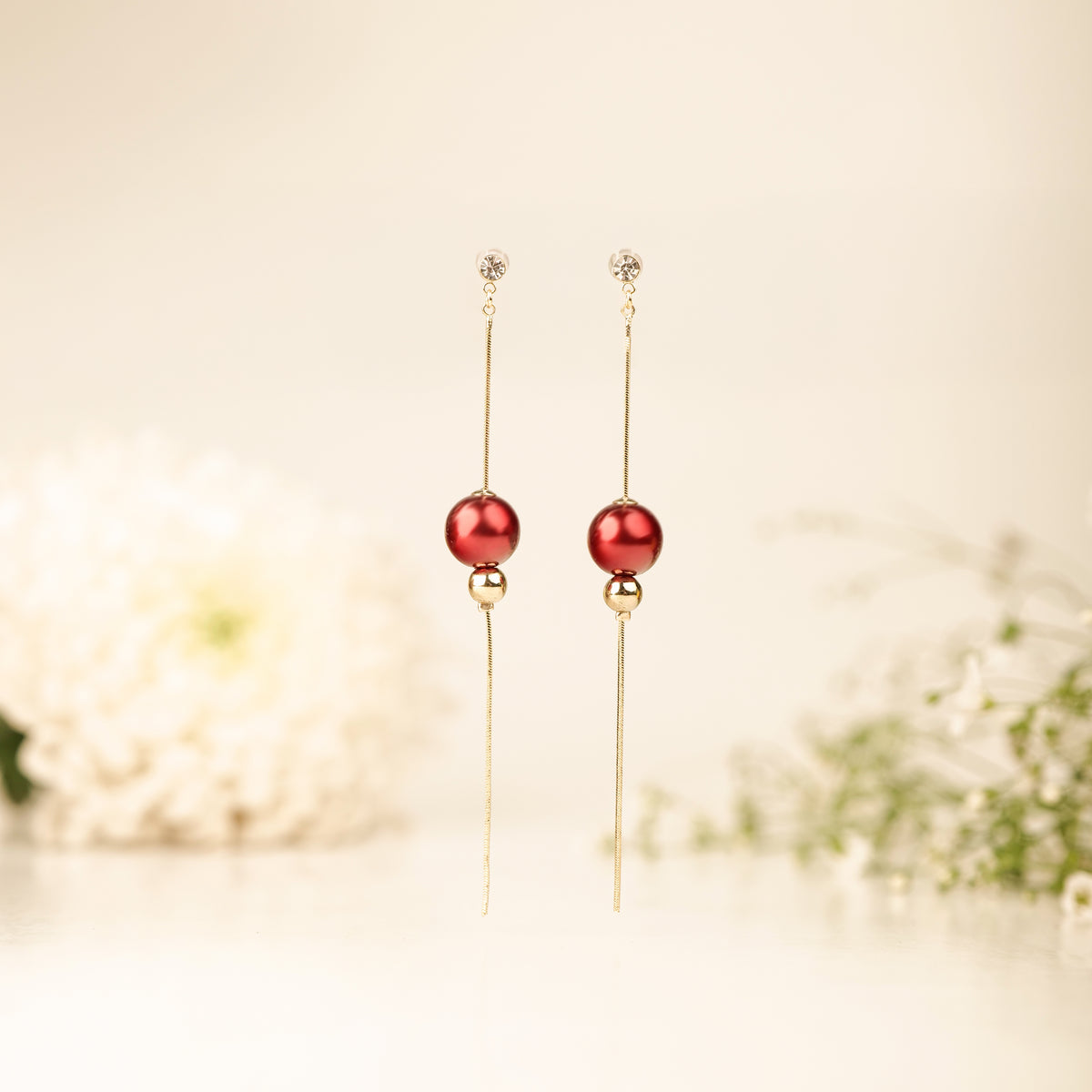 Scarlet Danglers earrings by Nashira, shown close up
