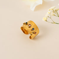 Multistone Thick Band ring by Nashira, shown close up