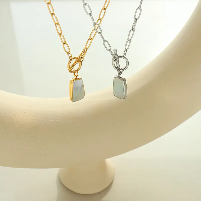 White Shell Pendant with Chain necklace by Nashira, shown close up