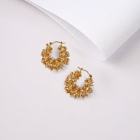 Friday Hoops earrings by Nashira, shown close up