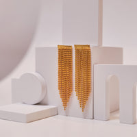 Rain Drop Tassel Earrings earrings by Nashira, shown close up