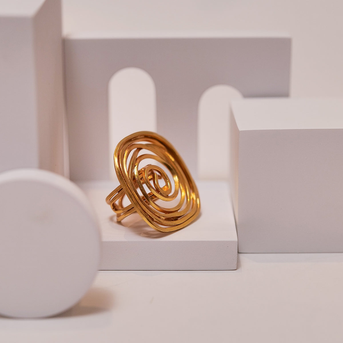 Spiral Rose Ring ring by Nashira, shown close up