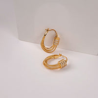 Sunday Hoops earrings by Nashira, shown close up