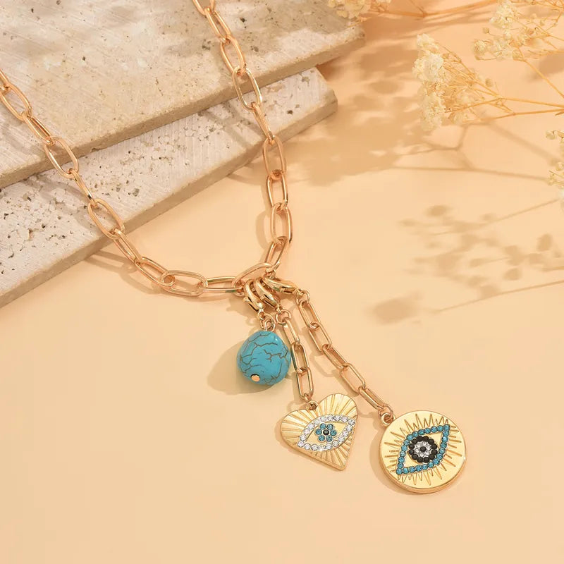 Main Character Evil Eye Charms Necklace necklace by Nashira, shown close up
