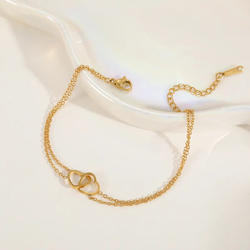 Double Heart Bracelet bracelet by Nashira, shown close up