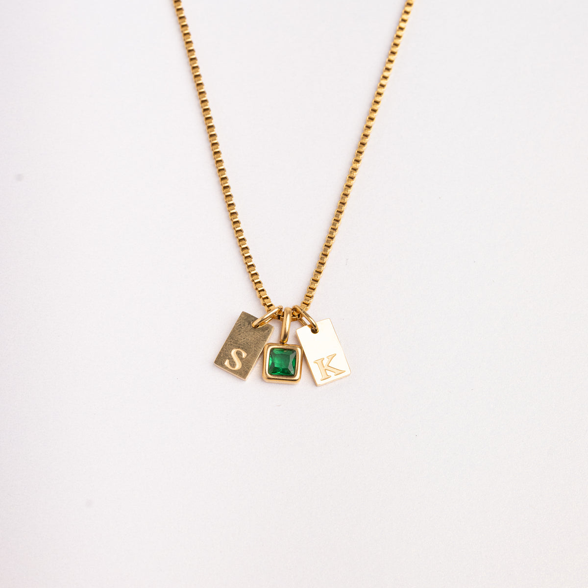 Dainty Alphabet String - Gold necklace by Nashira, shown close up