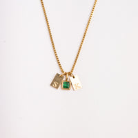 Dainty Alphabet String - Gold necklace by Nashira, shown close up