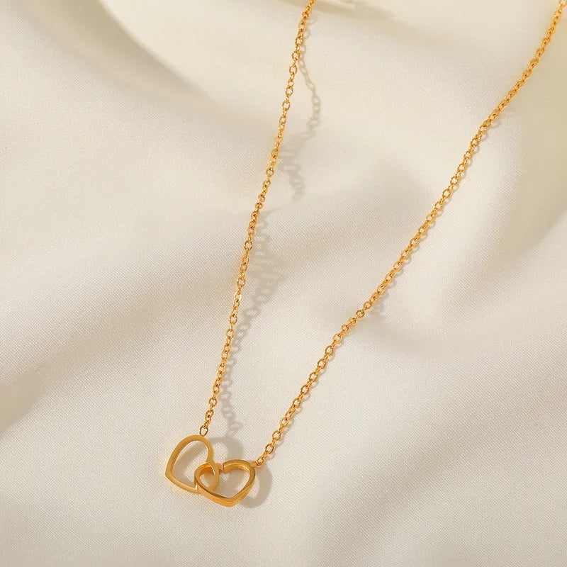 Double Heart Necklace necklace by Nashira, shown close up