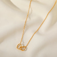 Double Heart Necklace necklace by Nashira, shown close up