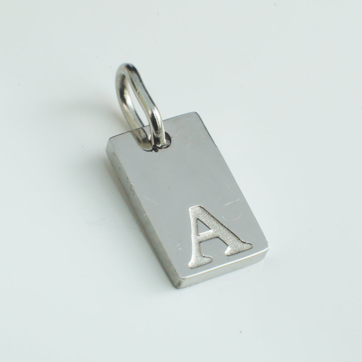 Dainty Alphabet Charm Silver - A - Stainless Steel charm by Nashira