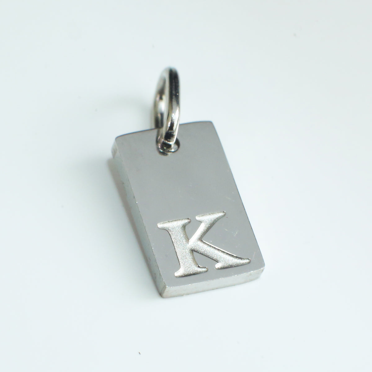 Dainty Alphabet Charm Silver - K - Stainless Steel charm by Nashira
