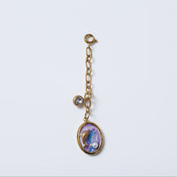 Underwater Baby Hanging Charm charm by Nashira, shown close up