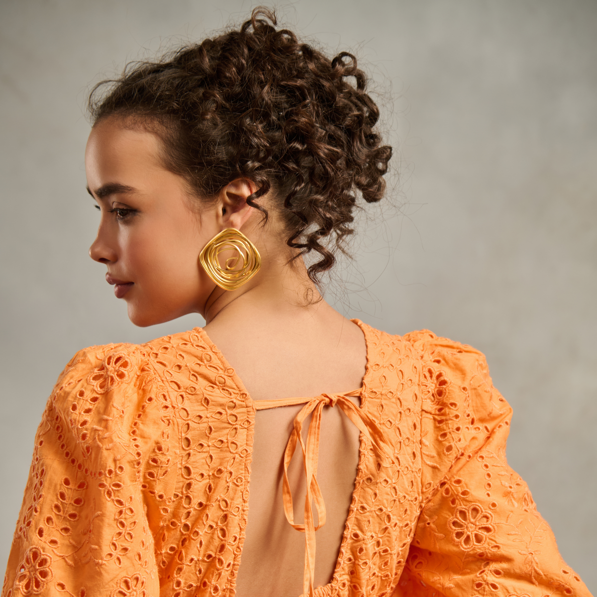 Spiral Rose Studs by Nashira, brass earrings