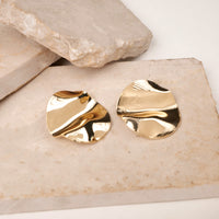Fluid Orbs earrings by Nashira, shown close up