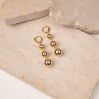 Glam Drops earrings by Nashira, shown close up