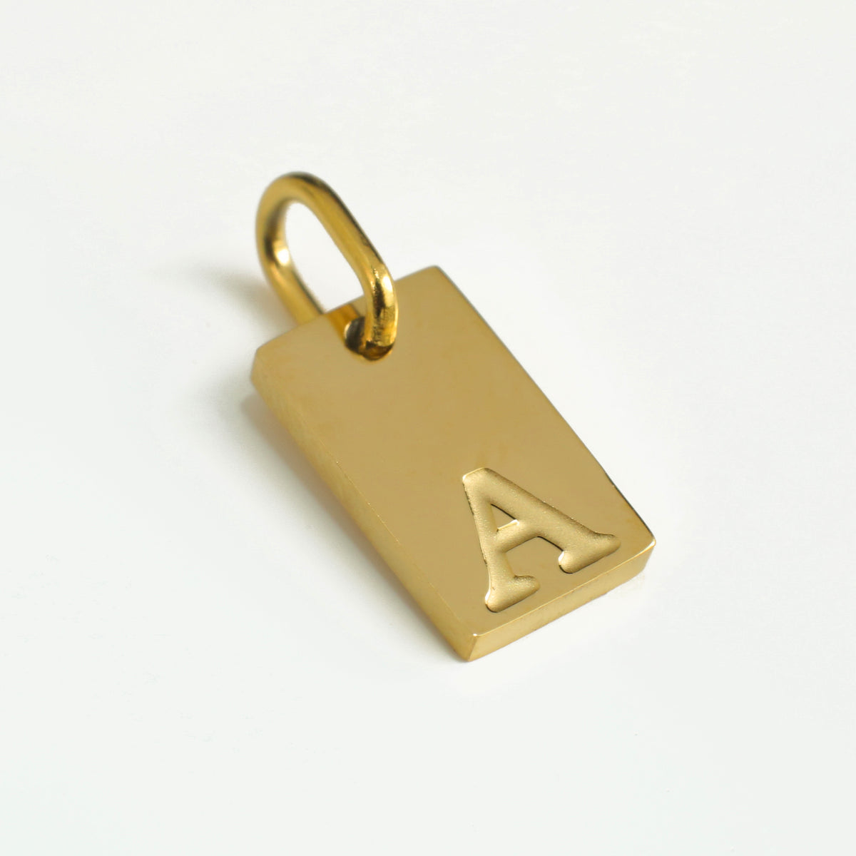 Dainty Alphabet Charm Gold  - A charm by Nashira, shown close up