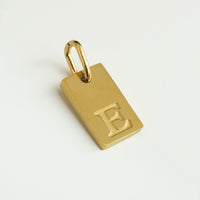 Dainty Alphabet Charm Gold  - E charm by Nashira, shown close up