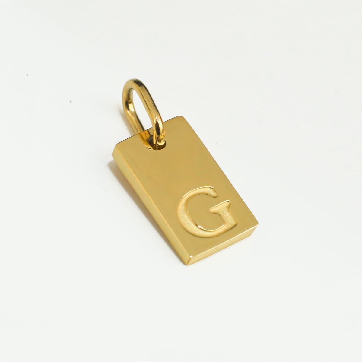 Dainty Alphabet Charm Gold  - G charm by Nashira, shown close up