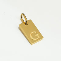 Dainty Alphabet Charm Gold  - G charm by Nashira, shown close up