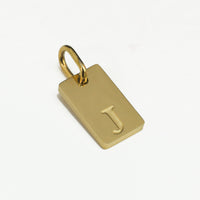 Dainty Alphabet Charm Gold  - J charm by Nashira, shown close up