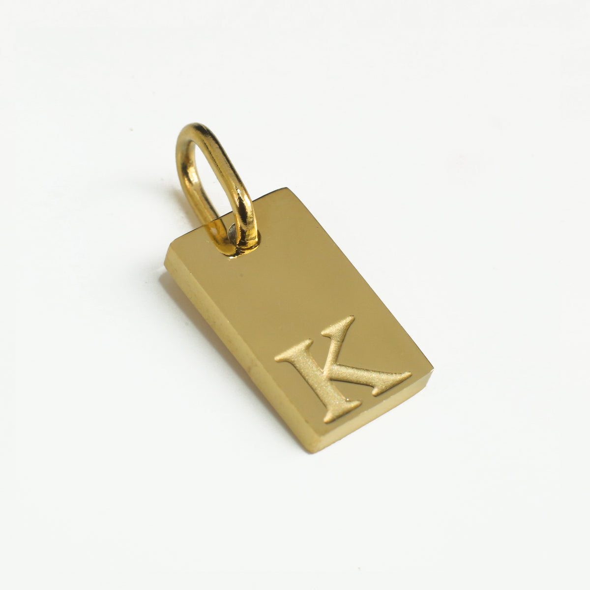 Dainty Alphabet Charm Gold  - K charm by Nashira, shown close up
