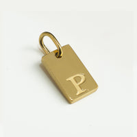 Dainty Alphabet Charm Gold  - P charm by Nashira, shown close up