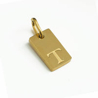 Dainty Alphabet Charm Gold  - T charm by Nashira, shown close up