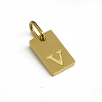 Dainty Alphabet Charm Gold  - V charm by Nashira, shown close up